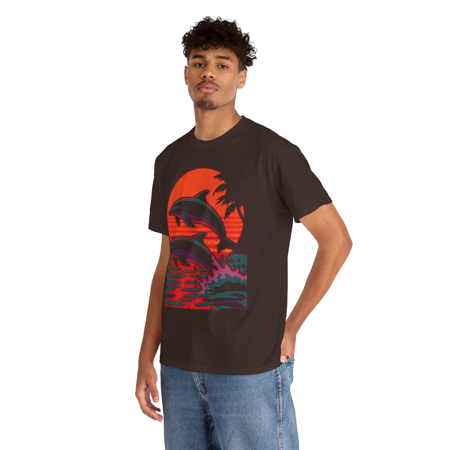 Man wearing Dithered Retro Design of two dolphins jumping out of the water in front of a sunset with tropical palm trees on a brown shirt