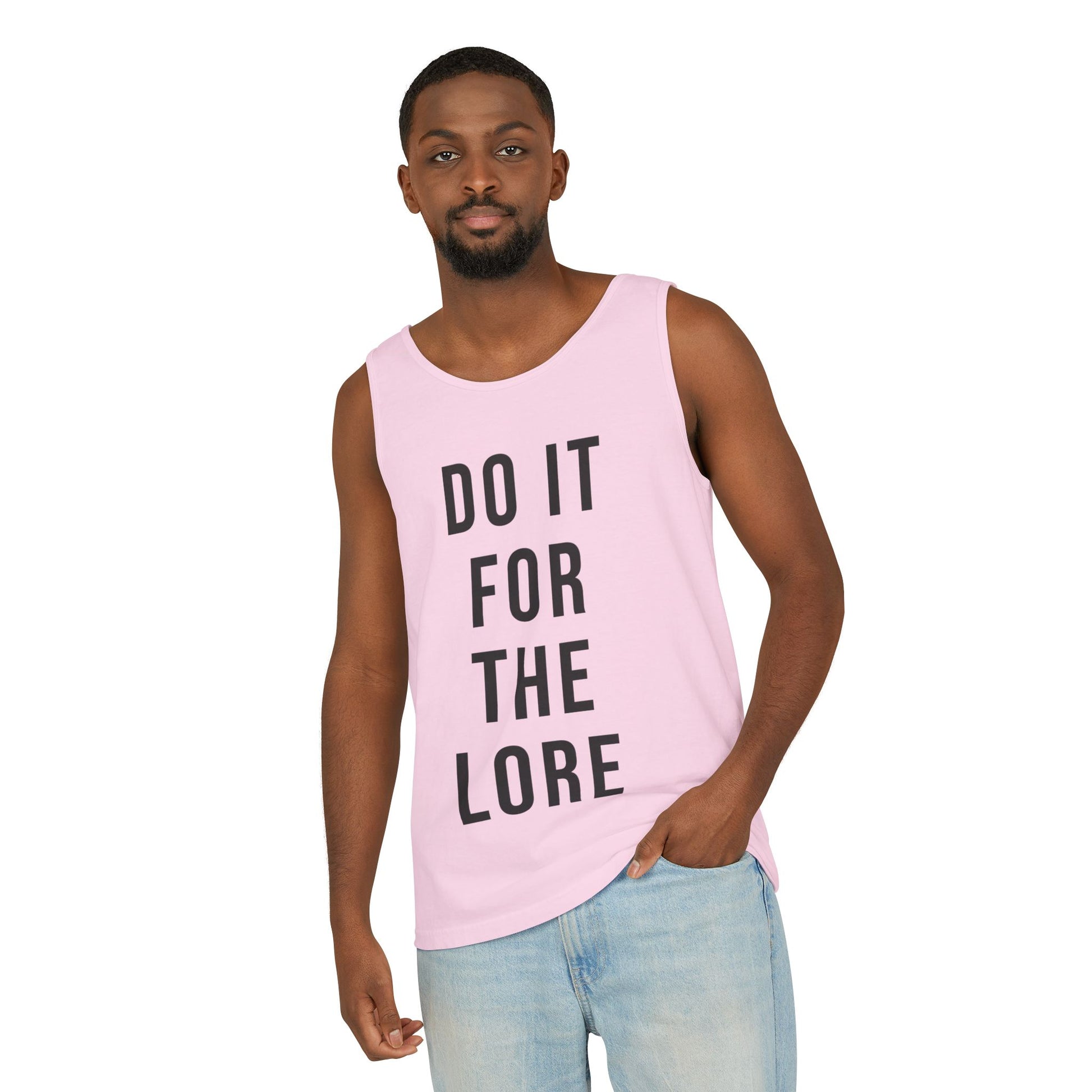 Man wearing Blossom Pink Tank Top with the bold text "DO IT FOR THE LORE" 