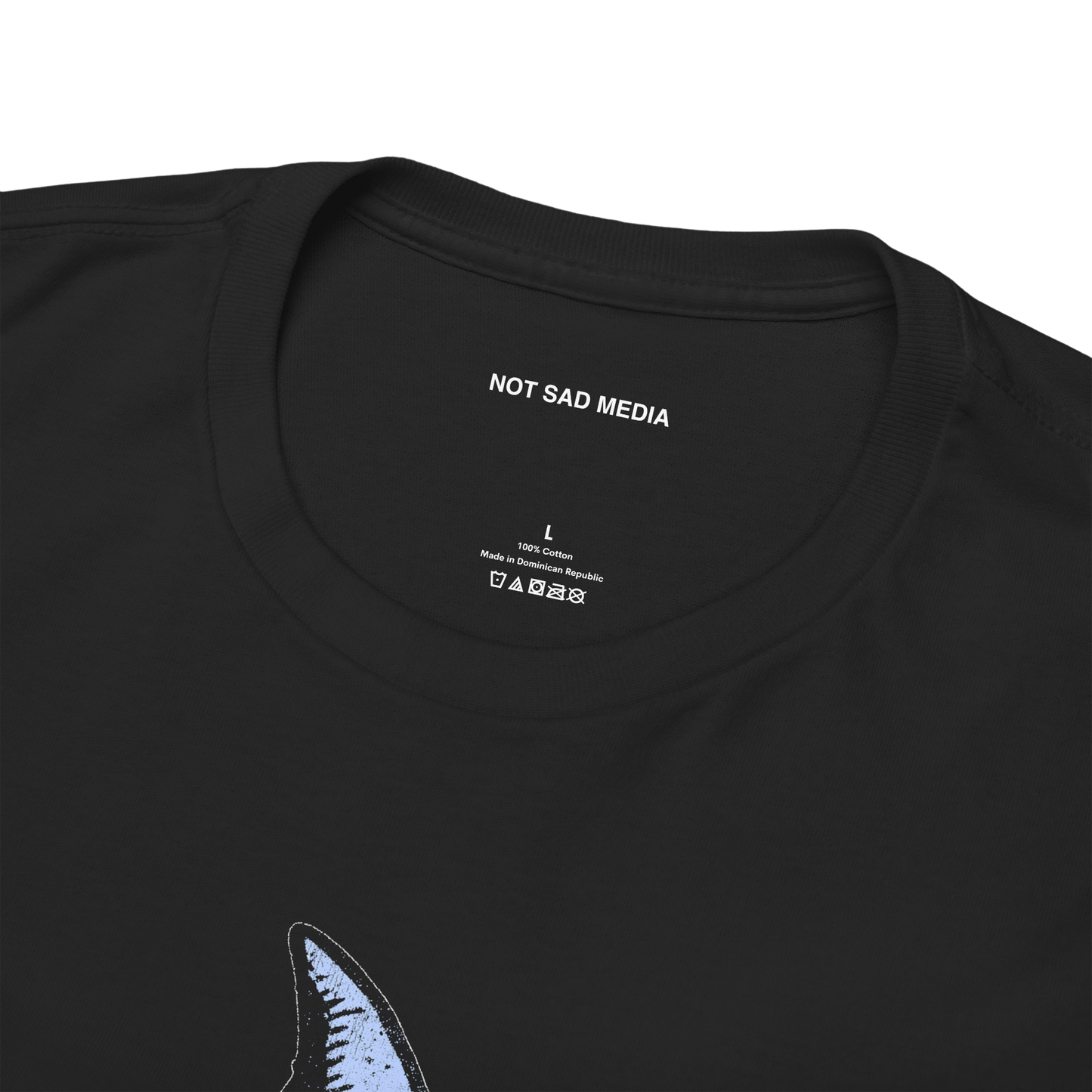 Inner neck label with washing instructions and NOT SAD MEDIA logo
