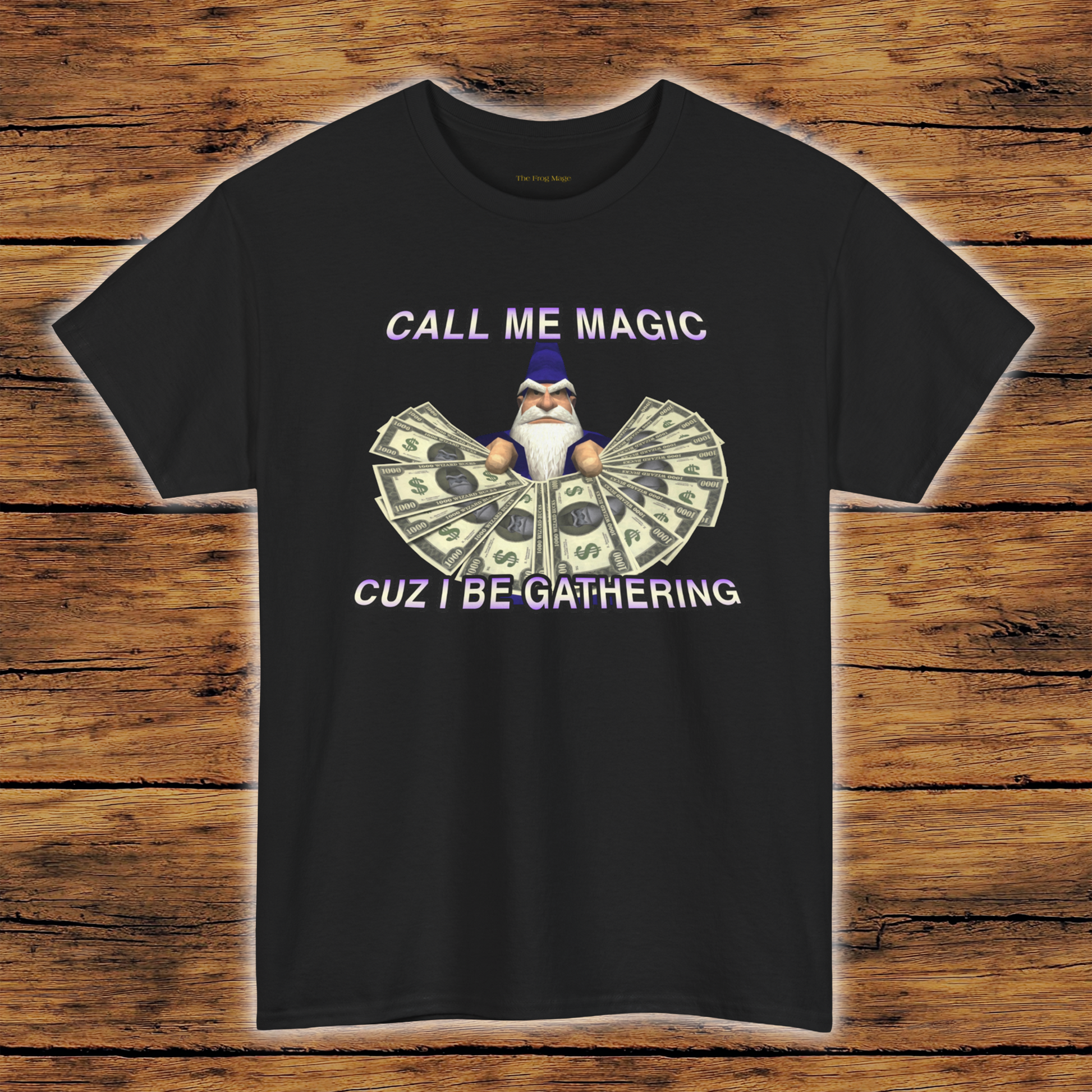 Black t-shirt with a graphic of a wizard holding money and text on a wooden background
