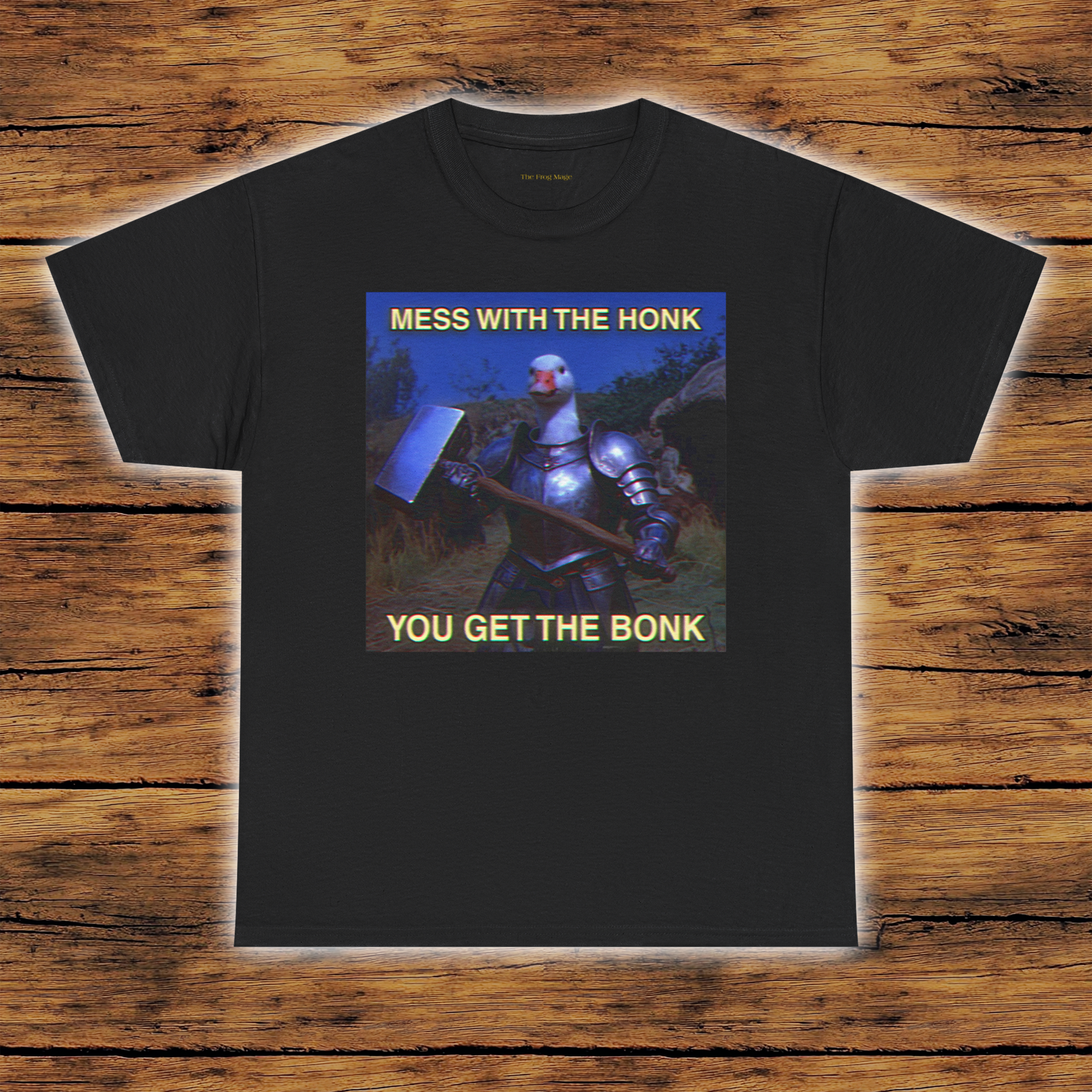 Black T Shirt featuring a goose in knights armor holding a large hammer standing outside with the text "MESS WITH THE HONK YOU GET THE BONK"